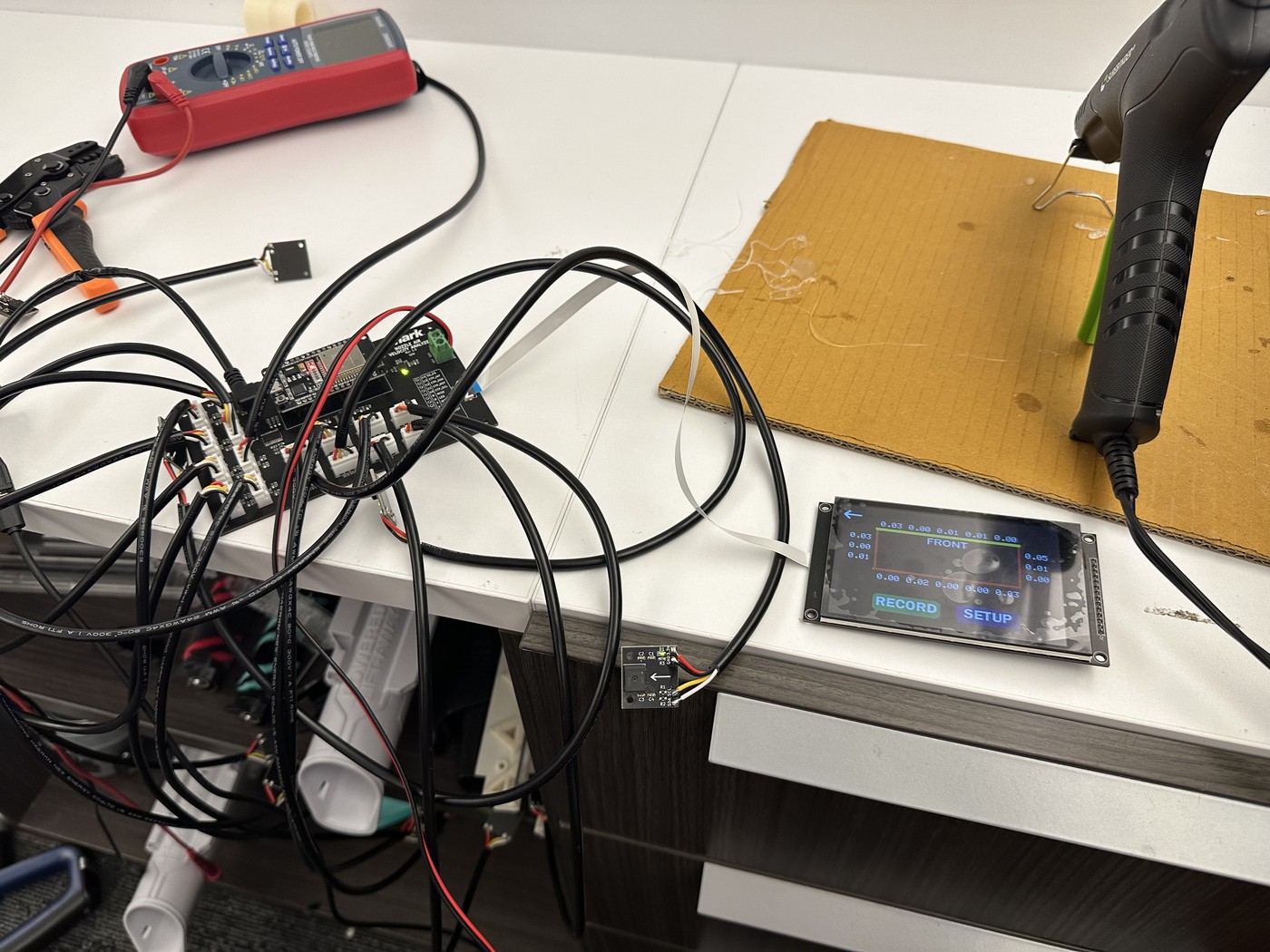 The boards and sensors wired up on the bench for testing